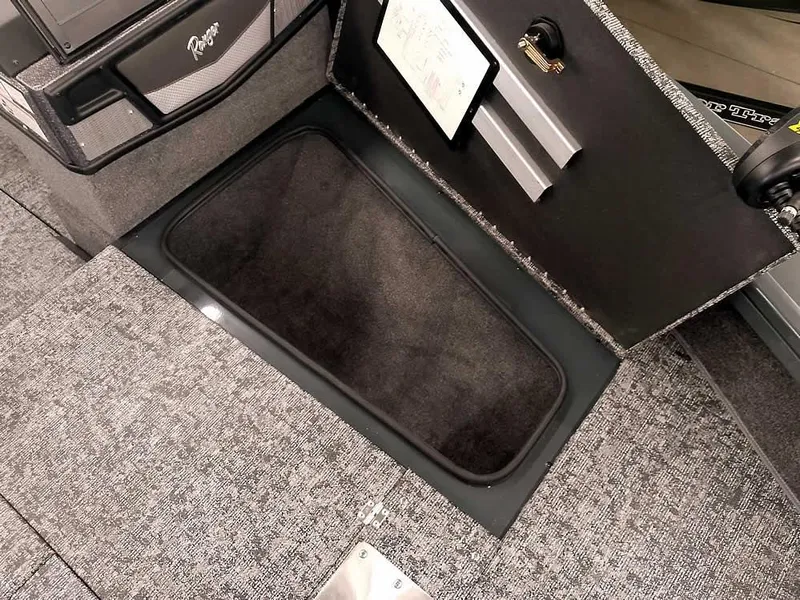 Slide: The Image of 2025 Ranger VX1988 WT boat storage compartment with open lid, showcasing interior space. - 21