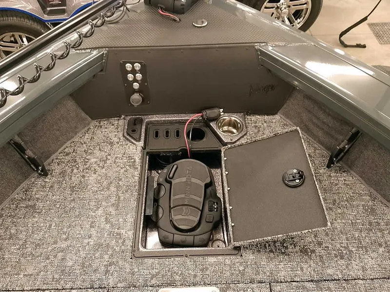 Slide: The Image of Interior of 2025 Ranger VX1988 WT boat with storage compartments and control panel. - 22