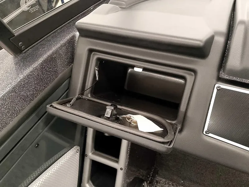 Slide: The Image of Open storage compartment in 2025 Ranger VX1988 WT boat dashboard. - 27