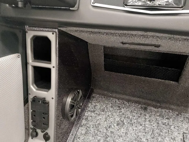 Slide: The Image of Interior of 2025 Ranger VX1988 WT boat, featuring speaker and storage compartment. - 29