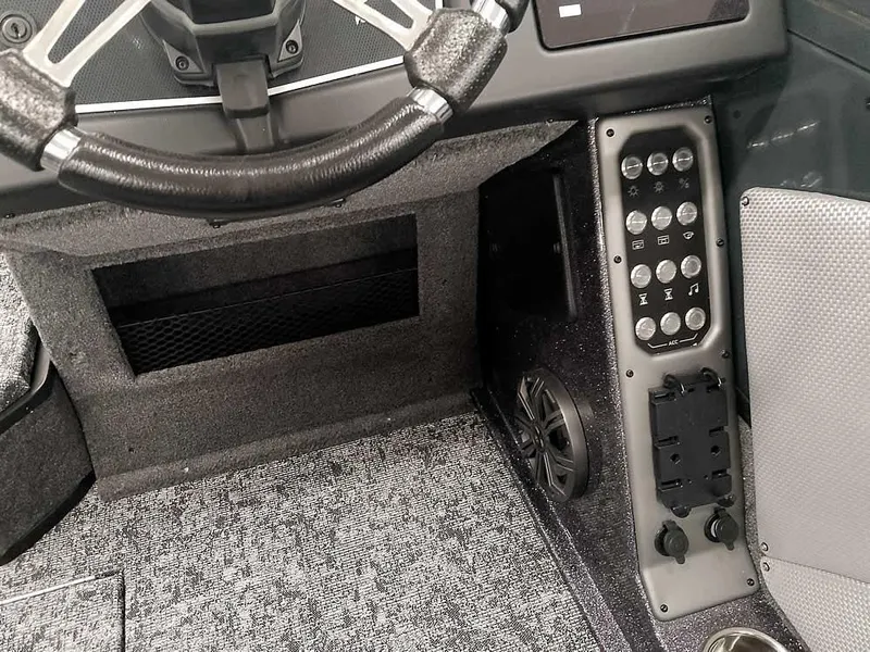 Slide: The Image of Interior of 2025 Ranger VX1988 WT boat, featuring steering wheel and control panel. - 31