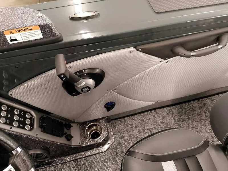 Slide: The Image of Interior of 2025 Ranger VX1988 WT boat, featuring control panel and seating. - 32