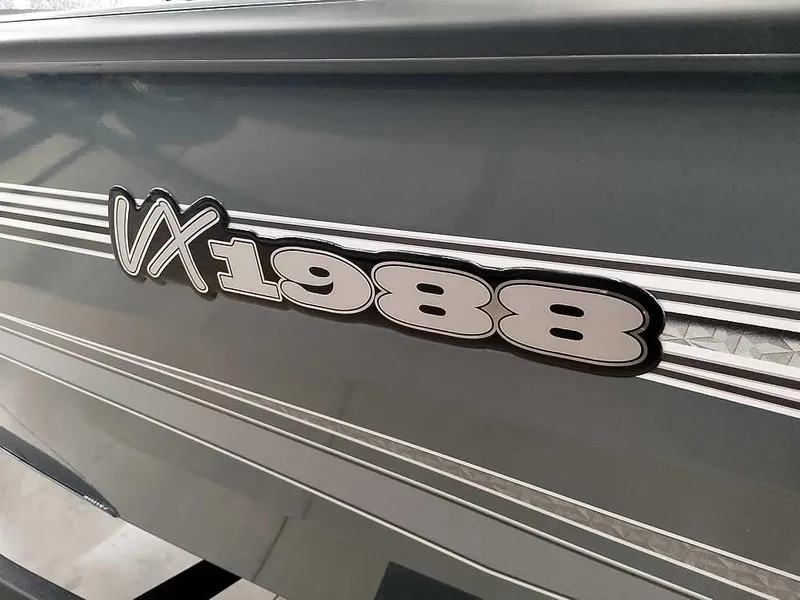 Slide: The Image of 2025 Ranger VX1988 WT boat model decal on gray surface. - 5