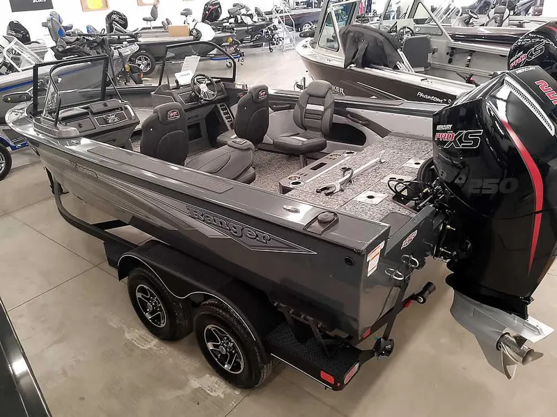 Slide: The Image of 2025 Ranger VX1988 WT boat in showroom, featuring dual seats and powerful outboard motor. - 7