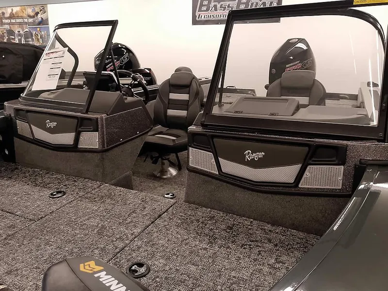 Slide: The Image of 2025 Ranger VX1988 WT boat interior with dual consoles and seating, featuring modern design elements. - 9
