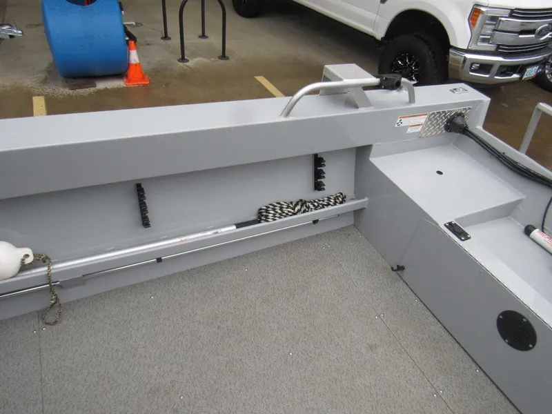 Slide: The Image of 2019 Hewescraft 200 Sportsman boat interior with storage compartments and safety equipment. - 10