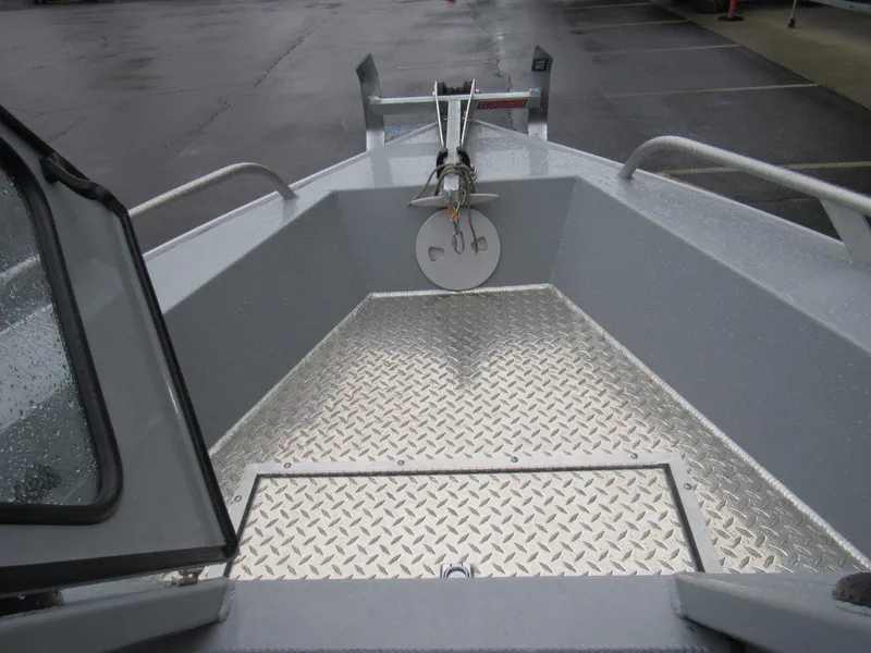 Slide: The Image of 2019 Hewescraft 200 Sportsman boat with diamond plate flooring and anchor setup. - 18