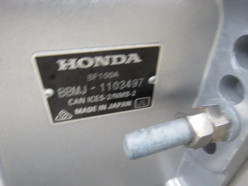 Slide: The Image of Close-up of a Honda engine label on a 2019 Hewescraft 200 Sportsman. - 20