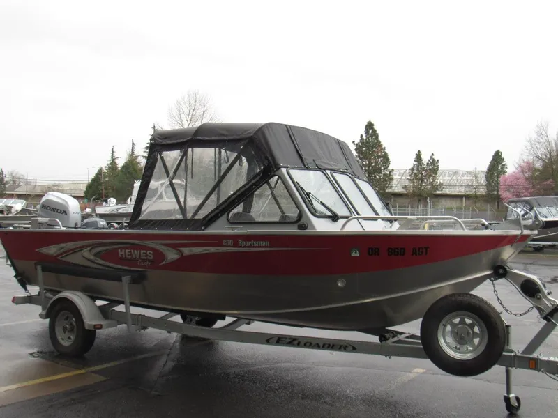 Slide: The Image of 2019 Hewescraft 200 Sportsman boat on trailer, parked outdoors. - 7
