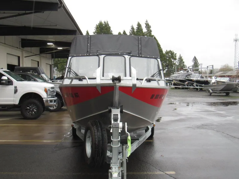 Slide: The Image of 2019 Hewescraft 200 Sportsman boat on trailer in parking lot. - 8