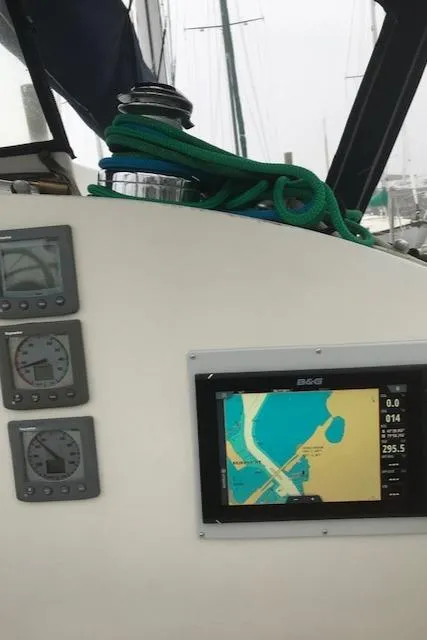 Slide: The Image of Nonsuch 33 sailboat cockpit with navigation instruments and chart plotter, 1988 model. - 12