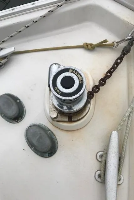 Slide: The Image of Maxwell windlass on 1988 Nonsuch 33 sailboat deck with chain and cleats. - 14