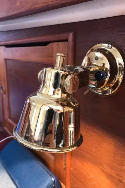 Slide: The Image of Brass wall-mounted light fixture on 1988 Nonsuch 33 sailboat interior. - 16