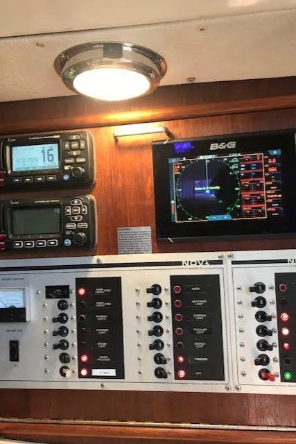 Slide: The Image of Control panel of a 1988 Nonsuch 33 sailboat with navigation and communication equipment. - 26