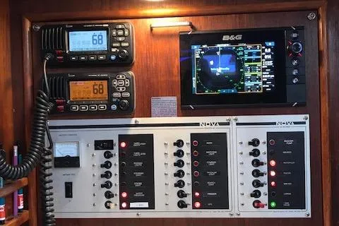 Slide: The Image of Control panel of a 1988 Nonsuch 33 sailboat with navigation and communication equipment. - 27