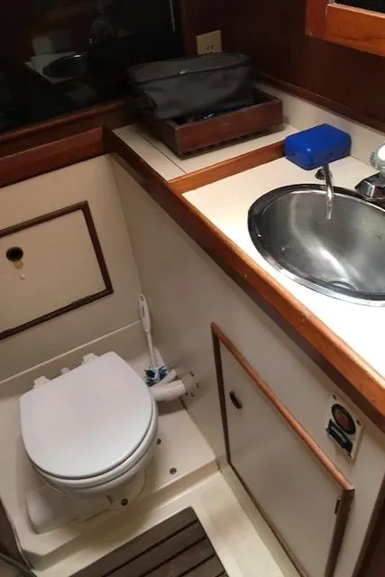 Slide: The Image of 1988 Nonsuch 33 yacht bathroom with sink and toilet. - 30