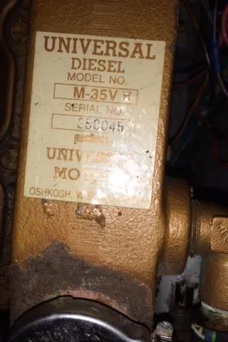 Slide: The Image of Universal Diesel engine label, model M-35V, serial number 350045, on a 1988 Nonsuch 33. - 34