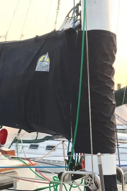 Slide: The Image of 1988 Nonsuch 33 sailboat mast with Doyle sail cover in marina. - 6