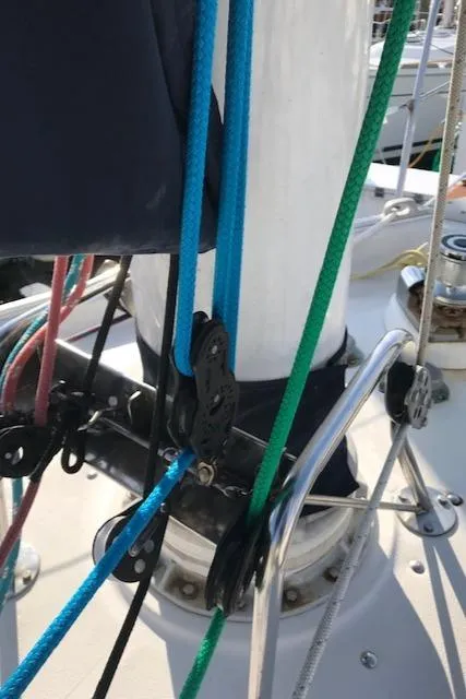 Slide: The Image of Close-up of 1988 Nonsuch 33 sailboat rigging with colorful ropes and pulleys. - 7