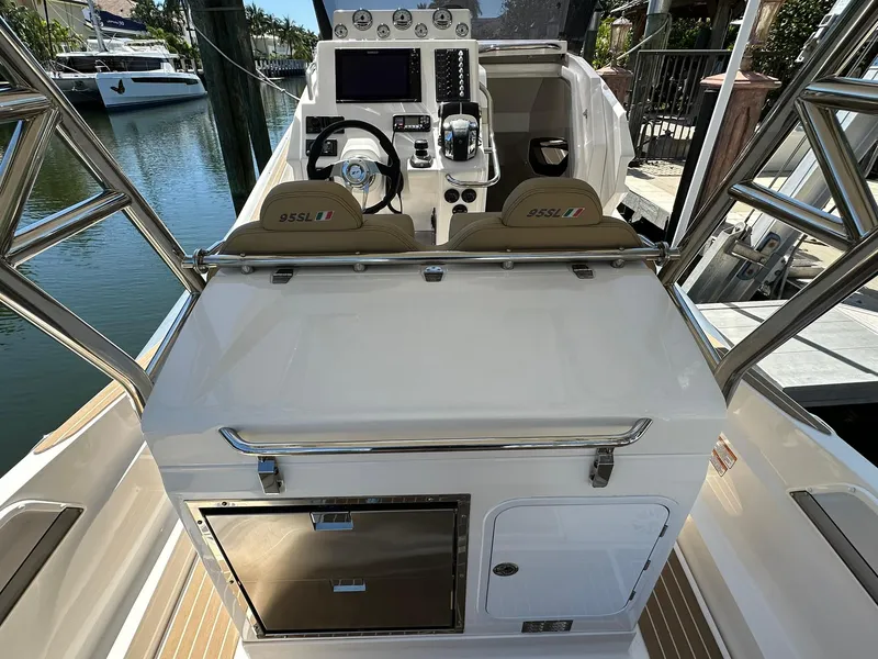 Slide: The Image of 2022 Zar Formenti 95 SL boat cockpit with modern controls and seating. - 11