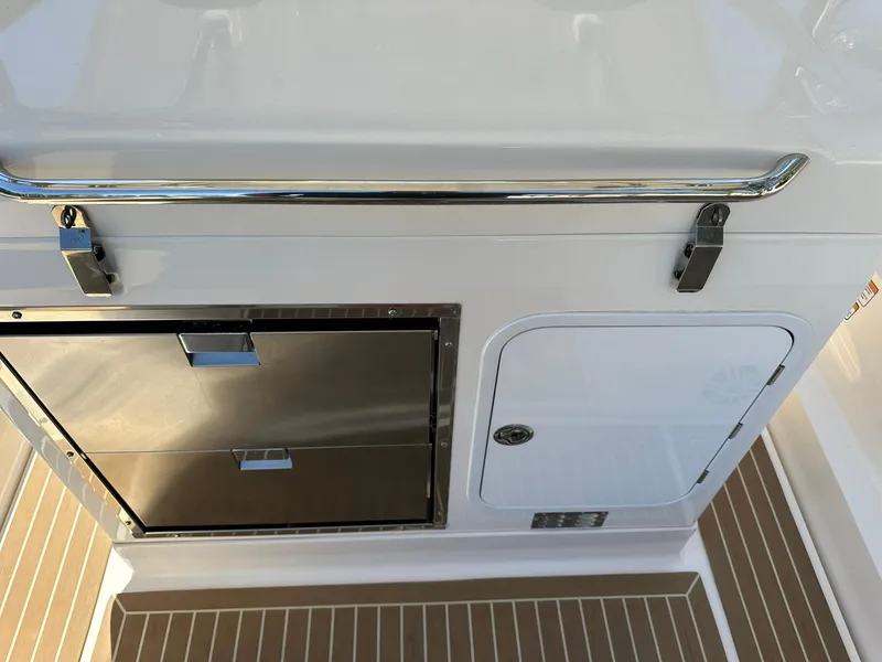 Slide: The Image of Zar Formenti 95 SL 2022 boat interior with storage compartments and sleek design. - 14