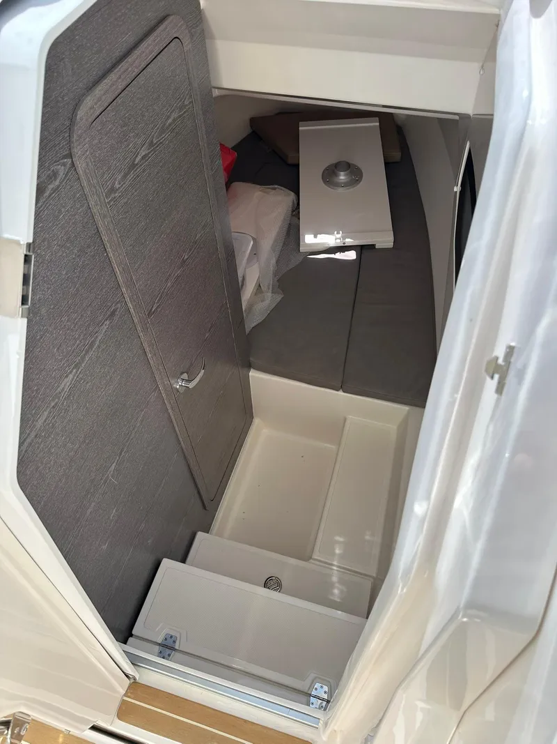 Slide: The Image of Interior cabin of 2022 Zar Formenti 95 SL boat, featuring seating and storage. - 17