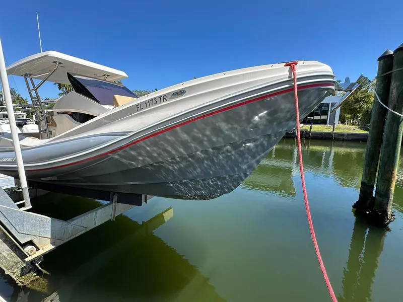 Slide: The Image of 2022 Zar Formenti 95 SL boat docked on a lift, sunny day. - 19