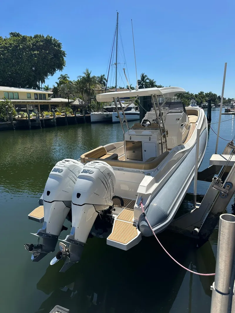 Slide: The Image of 2022 Zar Formenti 95 SL boat docked with dual outboard engines. - 20