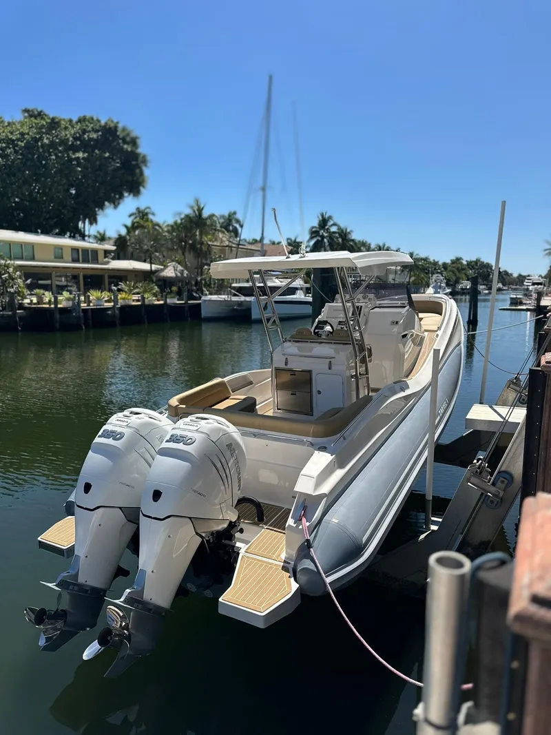 Slide: The Image of 2022 Zar Formenti 95 SL boat docked in a sunny marina. - 21