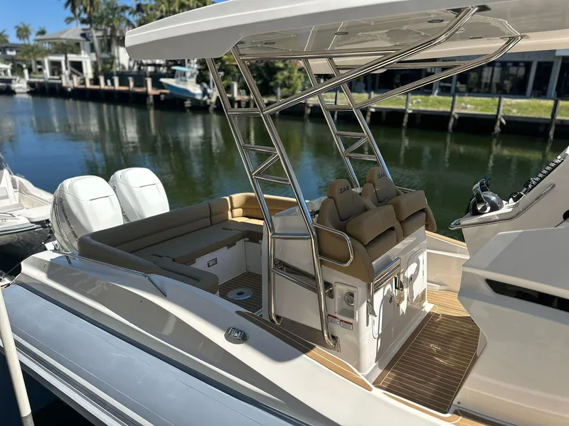 Slide: The Image of 2022 Zar Formenti 95 SL boat with dual engines docked by a waterfront. - 23