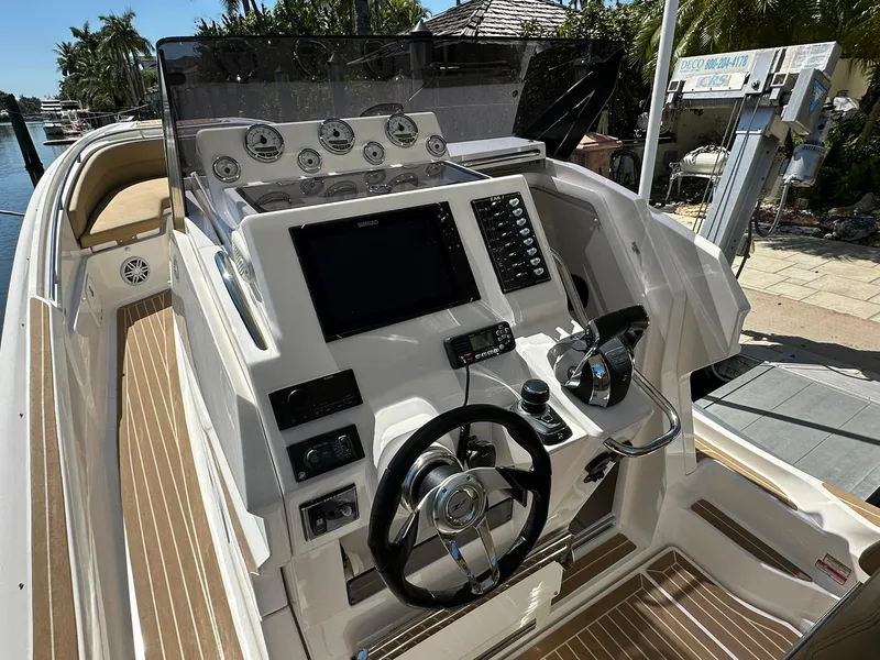 Slide: The Image of Cockpit of 2022 Zar Formenti 95 SL boat with modern controls and steering wheel. - 5