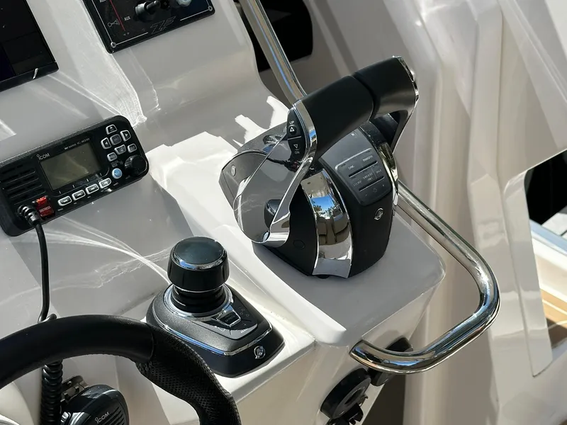 Slide: The Image of Control panel of 2022 Zar Formenti 95 SL boat with throttle and navigation equipment. - 6