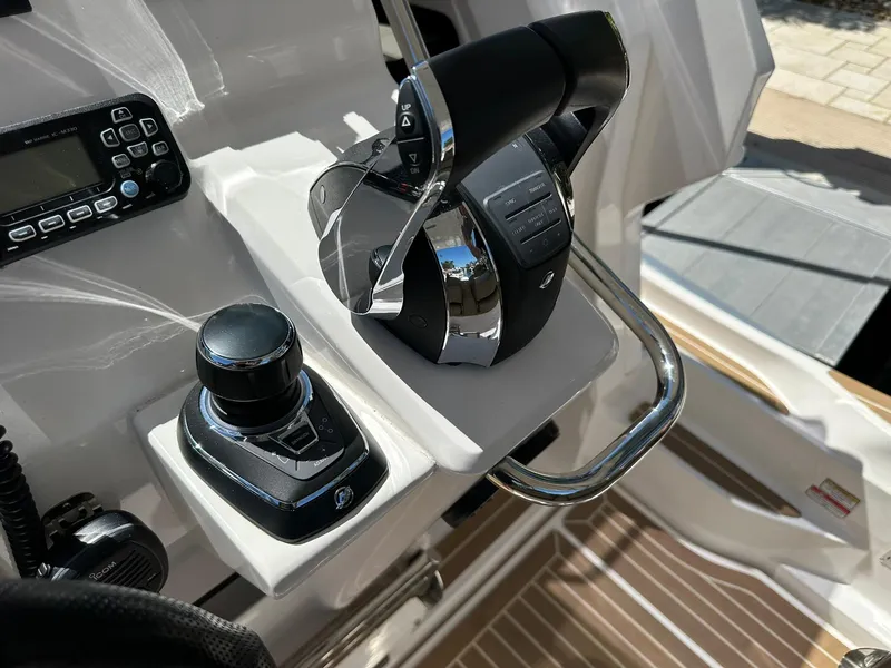 Slide: The Image of Control panel of 2022 Zar Formenti 95 SL boat with joystick and throttle. - 8