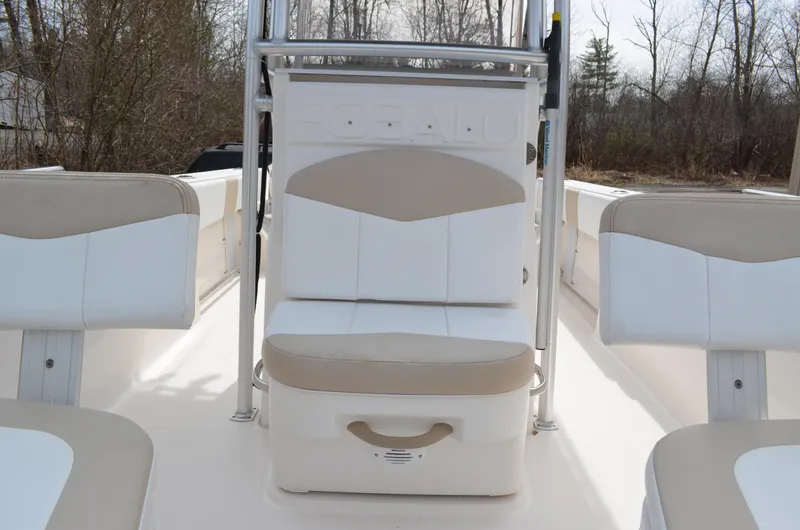Slide: The Image of 2018 Robalo R200 Center Console boat interior with white and beige seating. - 15