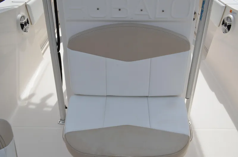 Slide: The Image of 2018 Robalo R200 Center Console boat seat, white and beige upholstery. - 16
