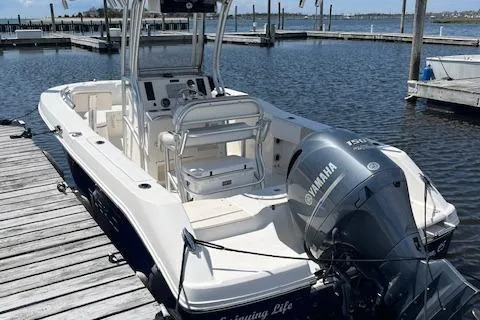 Slide: The Image of 2018 Robalo R200 Center Console boat docked with Yamaha outboard motor. - 2