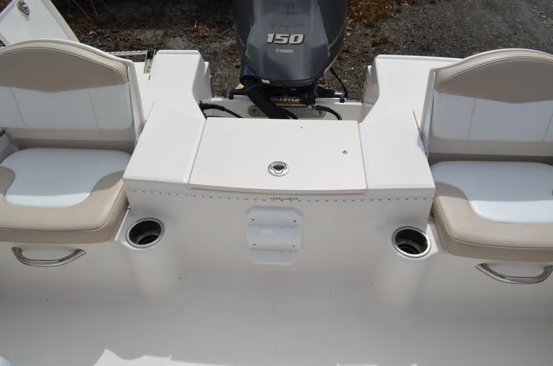 Slide: The Image of 2018 Robalo R200 Center Console boat interior with seating and Yamaha 150 engine. - 20