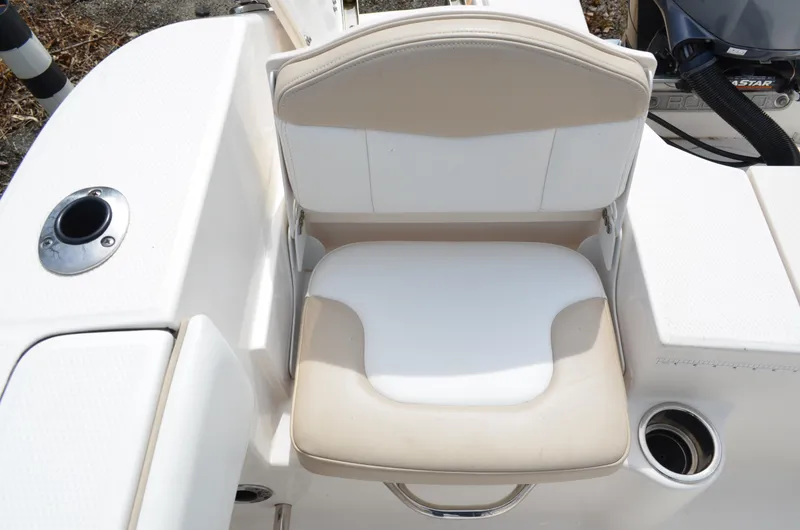 Slide: The Image of 2018 Robalo R200 Center Console boat seat with beige and white upholstery. - 21