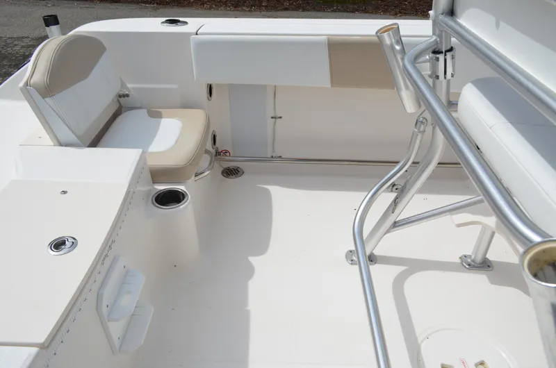 Slide: The Image of 2018 Robalo R200 Center Console boat interior with seating and stainless steel railings. - 25