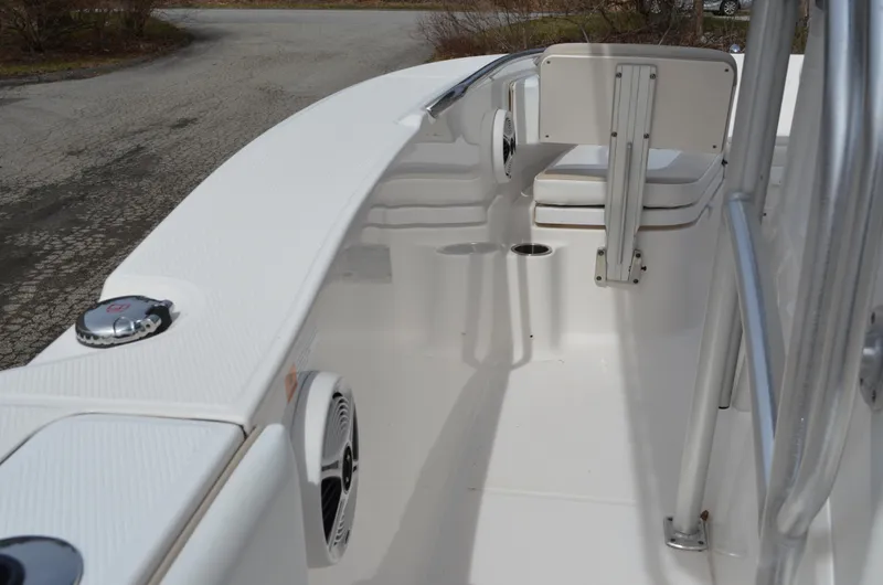 Slide: The Image of 2018 Robalo R200 Center Console boat interior with seating and speakers. - 27