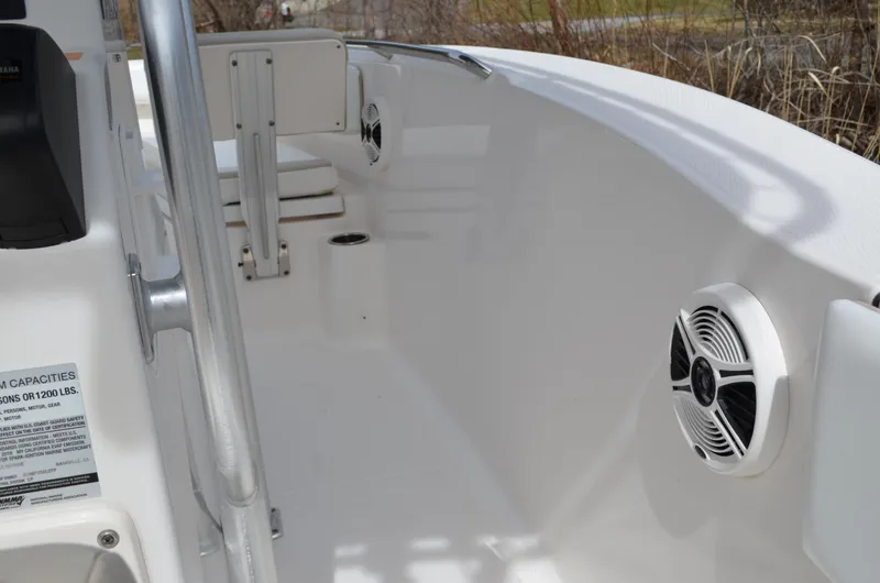 Slide: The Image of 2018 Robalo R200 Center Console boat interior with speakers and seating. - 28