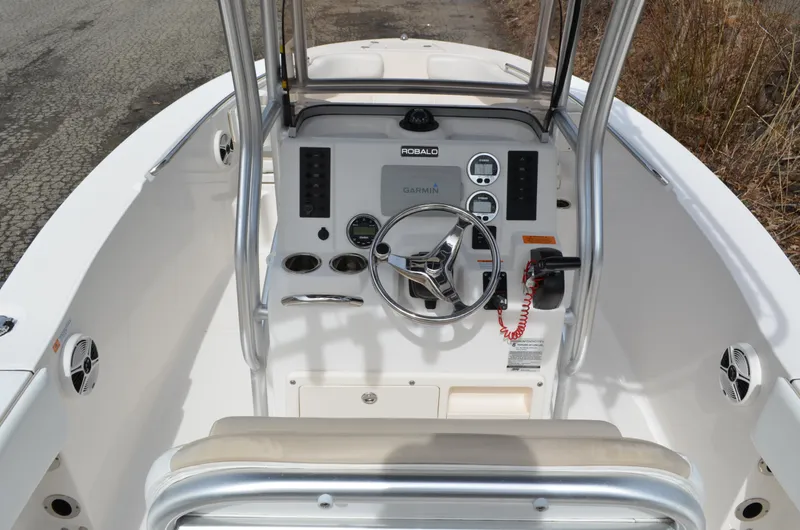 Slide: The Image of 2018 Robalo R200 Center Console boat interior with steering wheel and controls. - 29
