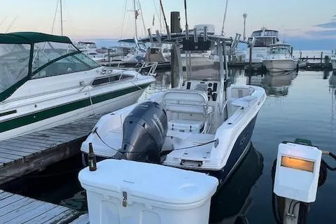 Slide: The Image of 2018 Robalo R200 Center Console boat docked at marina with other vessels. - 3