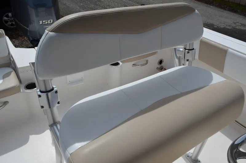 Slide: The Image of 2018 Robalo R200 Center Console boat seating with beige and white upholstery. - 31
