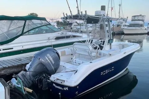Slide: The Image of 2018 Robalo R200 Center Console boat docked with Yamaha outboard motor. - 4