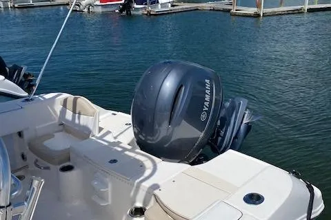 Slide: The Image of 2018 Robalo R200 Center Console boat with Yamaha outboard motor at a marina. - 5