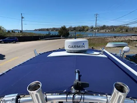 Slide: The Image of 2018 Robalo R200 Center Console with Garmin radar, parked near waterfront. - 6