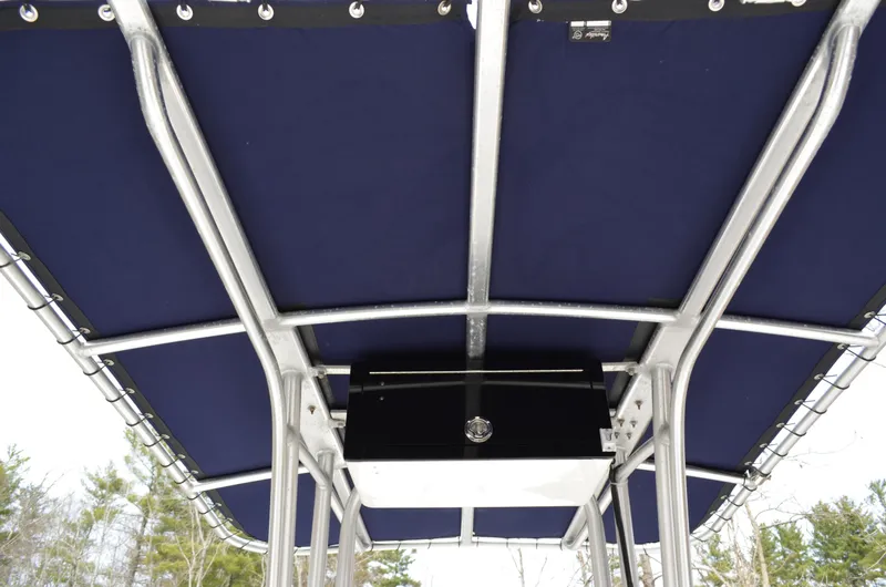 Slide: The Image of 2018 Robalo R200 Center Console boat with blue T-top canopy. - 7