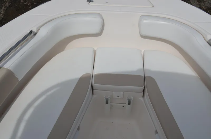 Slide: The Image of 2018 Robalo R200 Center Console boat seating area with cushioned seats. - 9