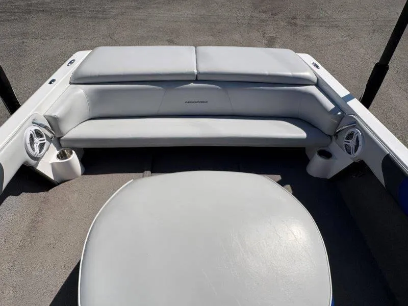 Slide: The Image of 2009 Moomba Outback SK boat interior with gray seating and speakers. - 19